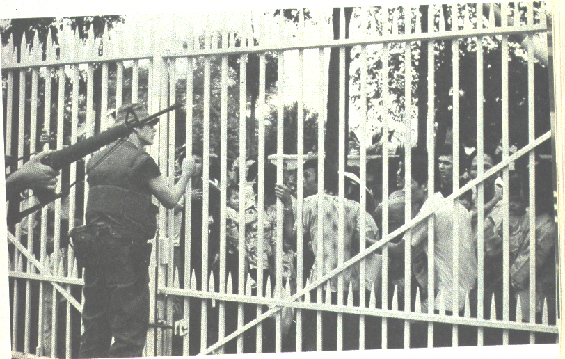 Famous photo of Richard wearing the bush hat standing next to the embassy gates.