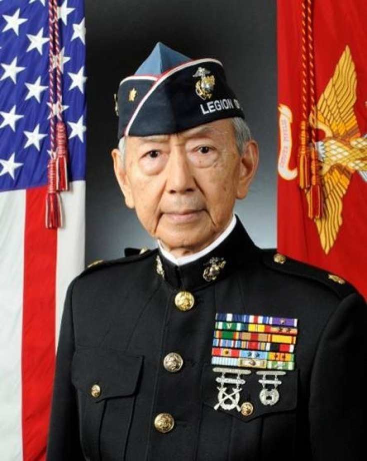 Formal portrait of retired major Kurt Lee in Marines dress blues and Legion of Valor cap.