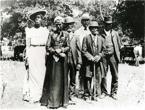 Photograph of six African Americans who've learned they are slaves no more.