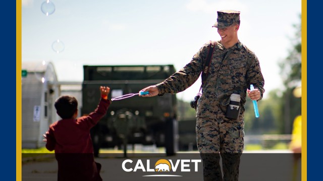 Marine Corps Lance Cpl. Scott Jenkins interacts with Afghan children at Marine Corps Base Quantico, Va., Aug. 30, 2021. The Defense Department through Northern Command and in support of the Department of Homeland Security, is providing transportation, temporary housing, medical screening and general support for up to 50,000 Afghan evacuees at suitable facilities, in permanent or temporary structures, as quickly as possible.