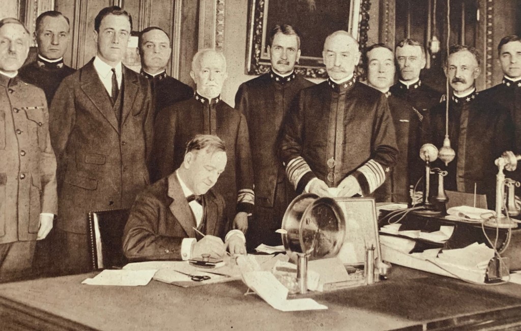 Photo of Josephus Daniels, with Franklin D. Roosevelt standing behind.