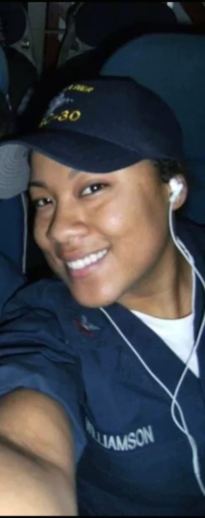 Williamson in Navy uniform smiling for the camera.