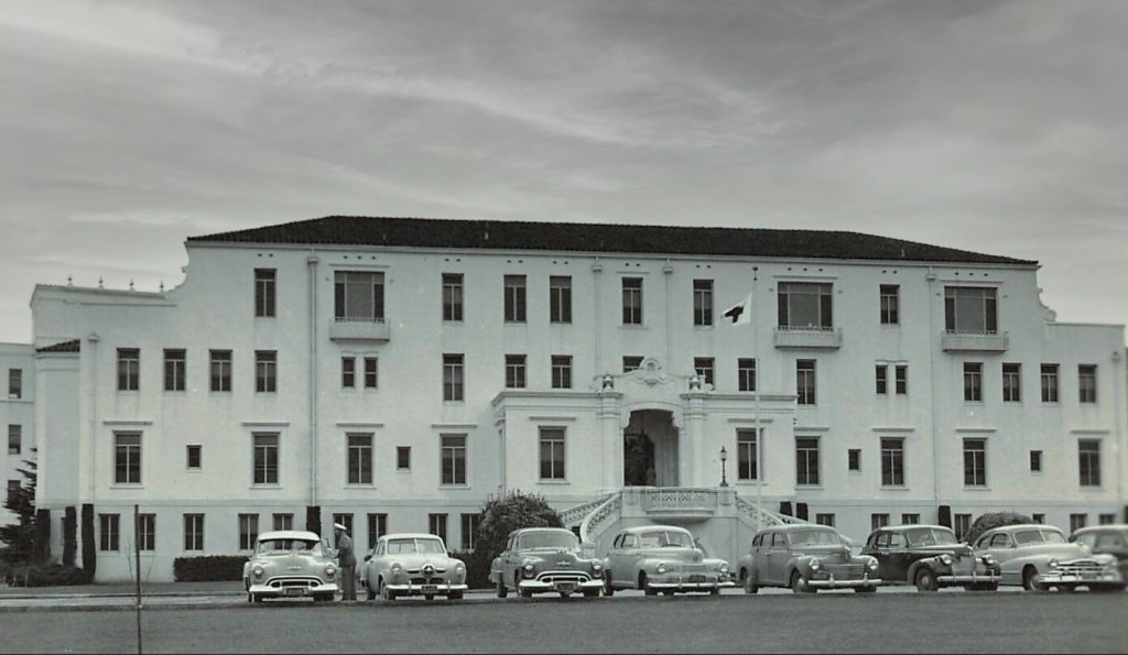 The Holderman Hospital photo taken in the early 1950s with cars parked out front.