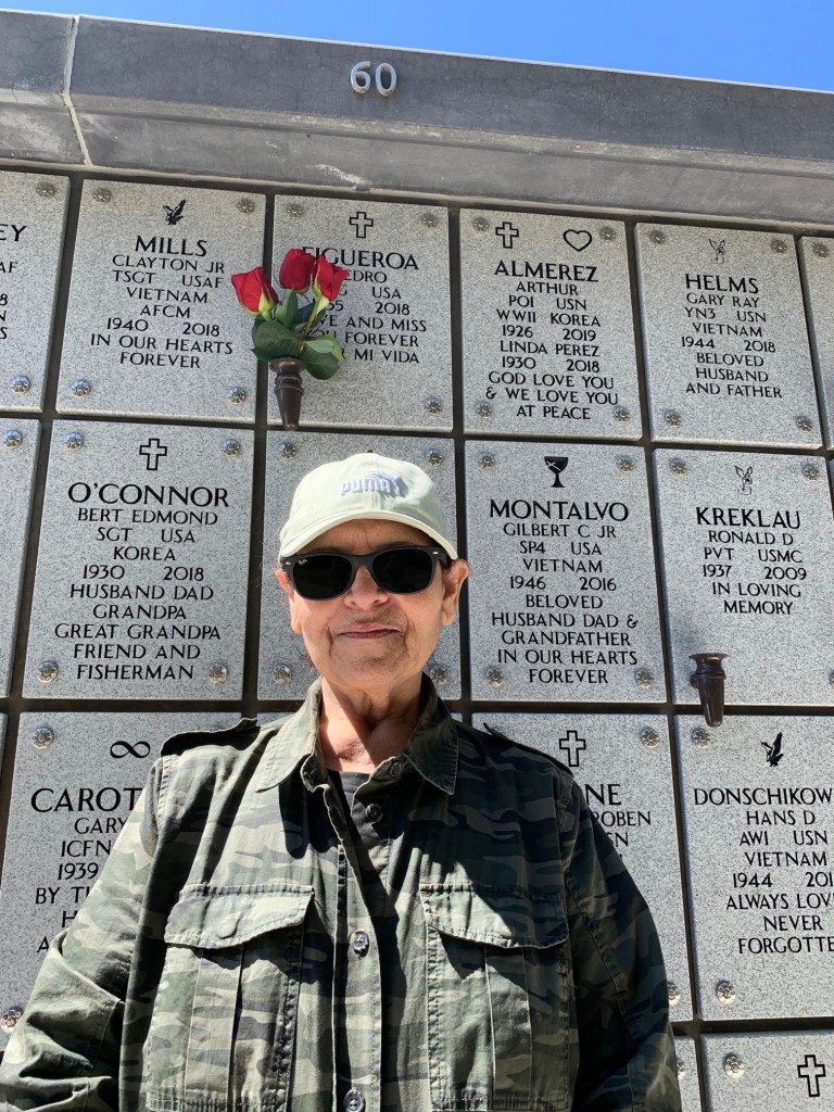 Catherine Figueroa wearing a camouflage coat and a ball cap.