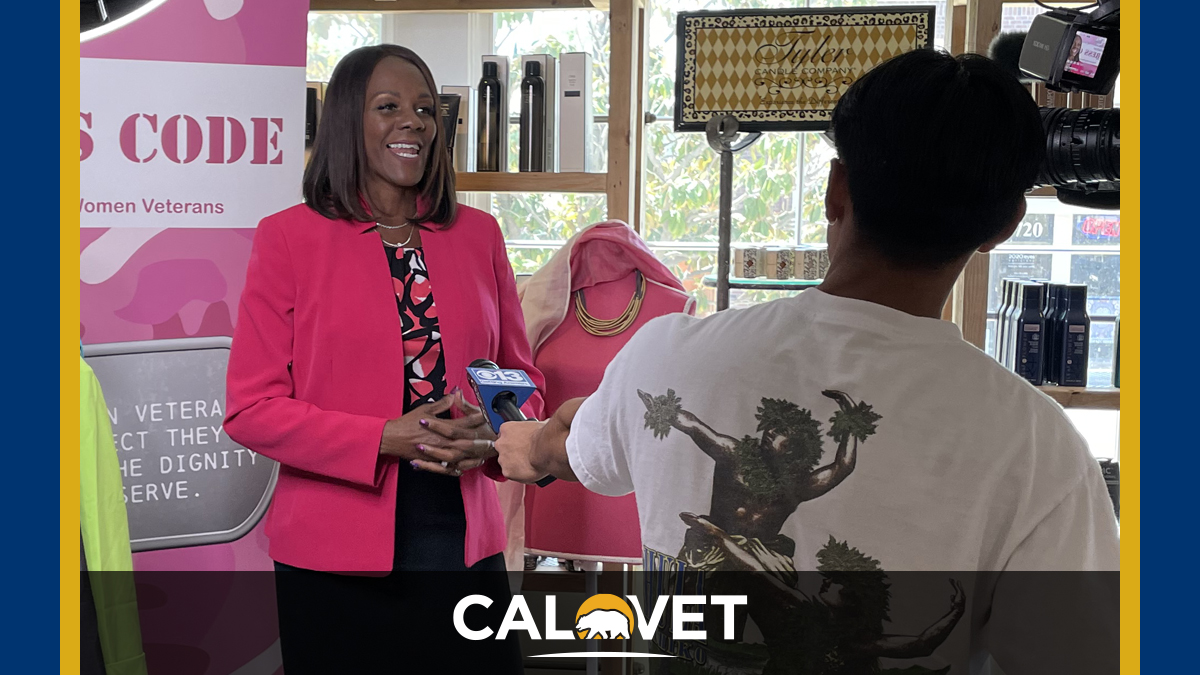 Deputy Secretary Virginia Wimmer speaks to a reporter regarding the launch of the clothing drive.