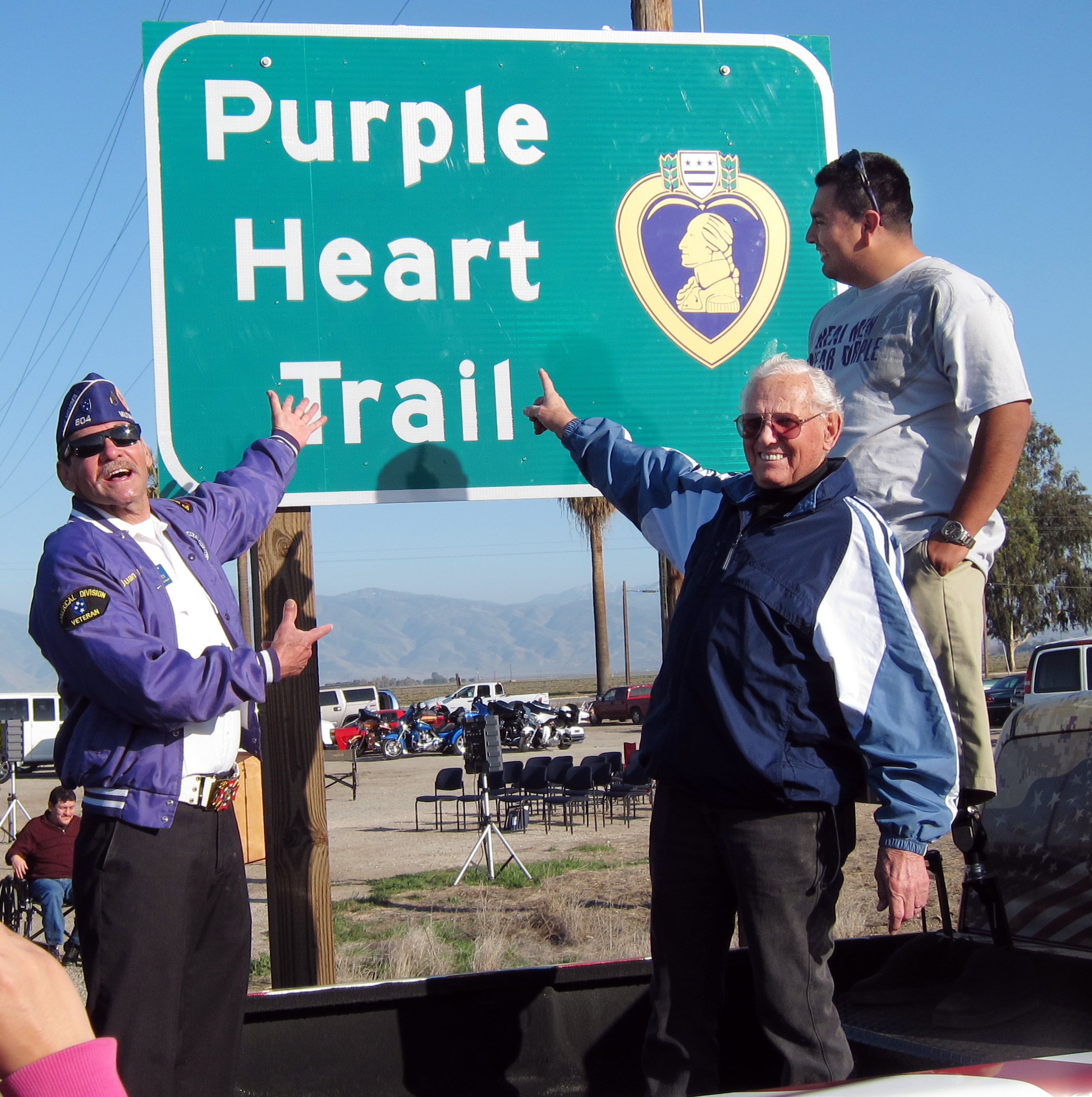 Military veterans , all Purple Heart recipients, unveiled the new sign marking a section of Highway 223 as part of the Purple Heart Trail. Photo courtesy of the Bakersfield Californian.