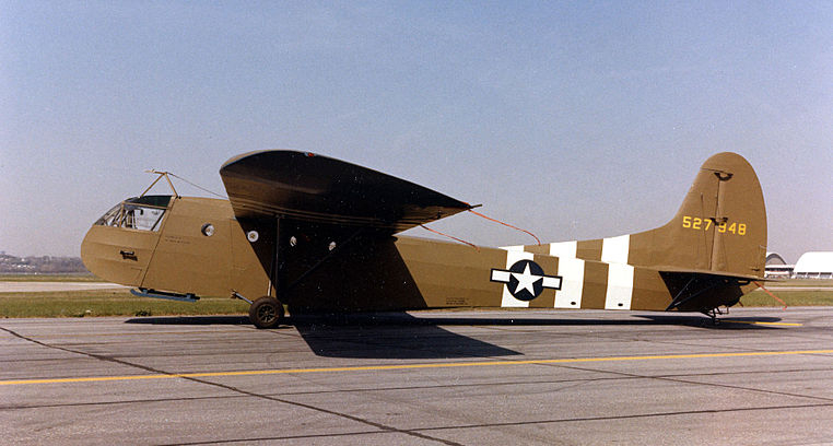 Army Air Force glider - painted a desert color with three white strips on the side of fuselage near the tail. The towing
