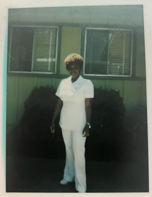 A photo of Kelly in her nurse uniform.