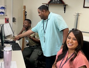 Three employees at the Veterans Home of California-Barstow at work.