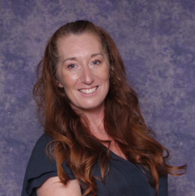 Woman smiling at camera.