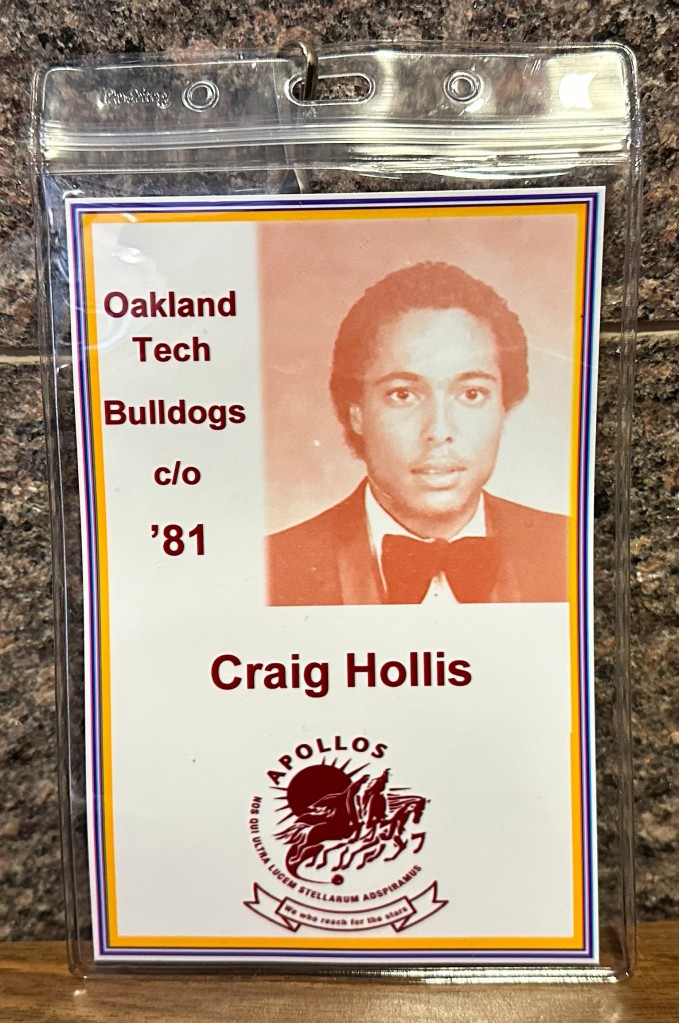 Badge with text "Oakland Tech Bulldogs c/o '81 Craig Hollis."