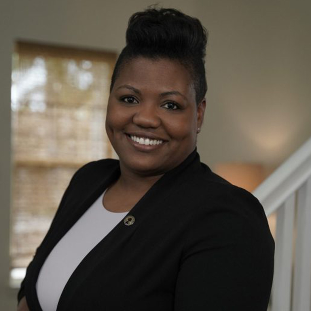 Smiling woman inside room.